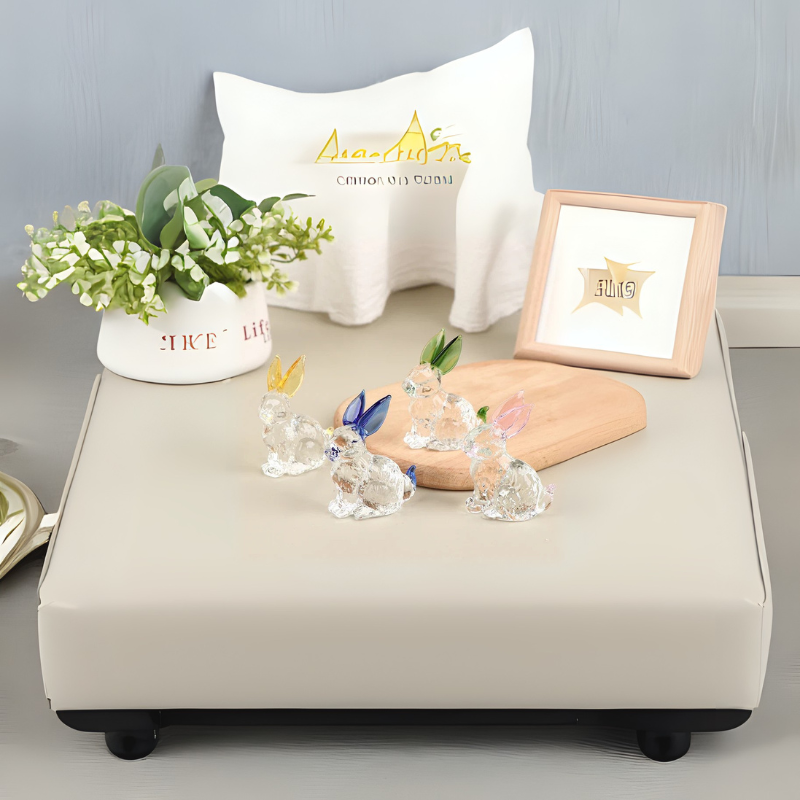 Charming tabletop display with mini crystal bunny figurines, greenery in a ceramic planter, and minimalist decor – styled by Milli Arts